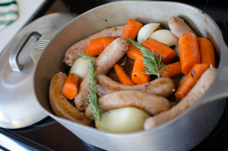 sausage, carrots, onions, and spices cooking