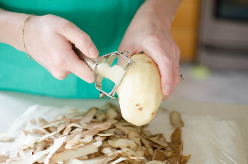 potatoes being peeled