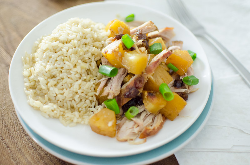 pineapple pork roast with rice on white plate